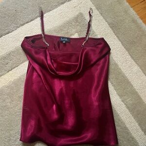 burgundy XS going out top. does have a broken strap but that’s easily fixable.